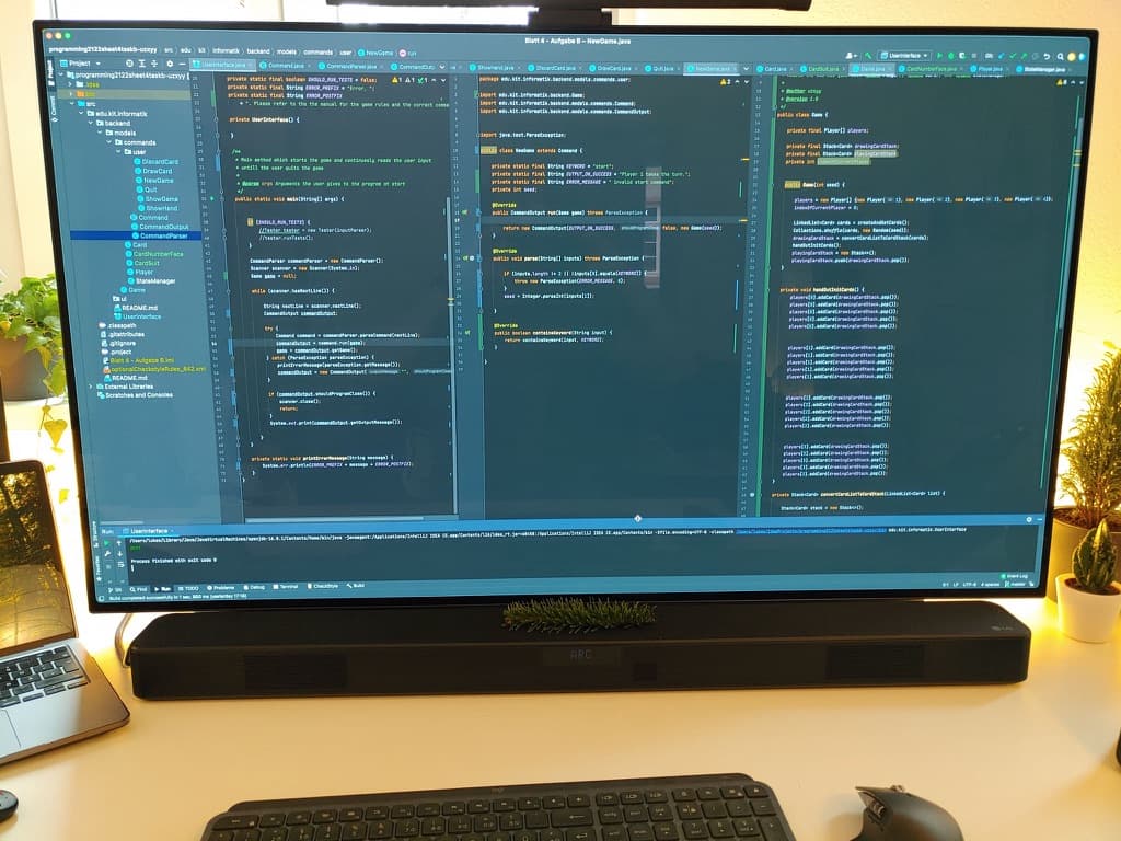 Desk with a monitor full of code at the Karlsruhe Institute of Technology